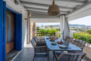 a blue table and chairs on a patio at Panorama Maisonette in Livadia