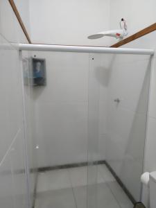 a bathroom with a shower and a sink at Pousada do guariba in Santa Teresa
