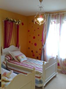 Ένα ή περισσότερα κρεβάτια σε δωμάτιο στο Villa Cendrillon