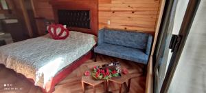 Voodi või voodid majutusasutuse Cabaña Bagheera toas
