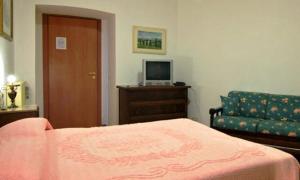 Ein Bett oder Betten in einem Zimmer der Unterkunft Le Stanze Di Nico