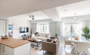 a living room with a couch and a table at The Carlyle Oceanfront Luxe Condo Miami Beach in Miami Beach