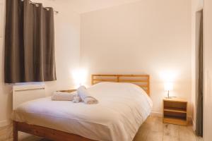 Ένα ή περισσότερα κρεβάτια σε δωμάτιο στο Appartement Hypercentre RDC - NEW LOCATION
