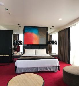 Voodi või voodid majutusasutuse Amaroossa Cosmo Jakarta toas