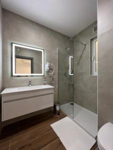 a bathroom with a sink and a shower at City Stay B&B in Taʼ l-Imgħajjen +81 photos