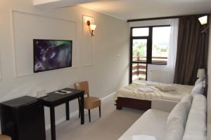 Afbeelding uit fotogalerij van Pensiunea Clasic in Buşteni