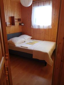 Postel nebo postele na pokoji v ubytování MARINA