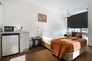Postel nebo postele na pokoji v ubytování Smart Stayzzz Inns