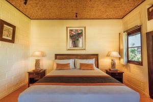 Postel nebo postele na pokoji v ubytování Munari Resort Ubud