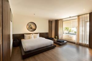 Giường trong phòng chung tại Cochin Zen Hotel +62 ảnh