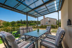 Patio alebo iná vonkajšia časť ubytovania Villa Giorgina