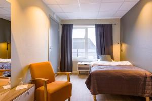 Postel nebo postele na pokoji v ubytování Corner Hotell