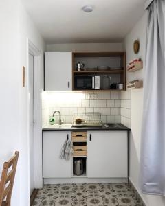Kuchyňa alebo kuchynka v ubytovaní Nest Apartman