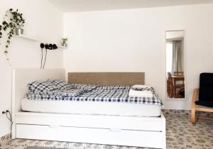 Posteľ alebo postele v izbe v ubytovaní Nest Apartman