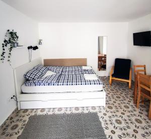 Posteľ alebo postele v izbe v ubytovaní Nest Apartman
