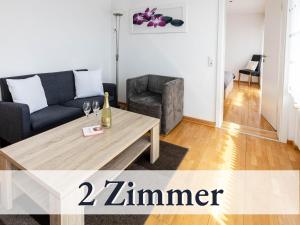 a living room with a couch and a table at Liggeringen in Radolfzell am Bodensee