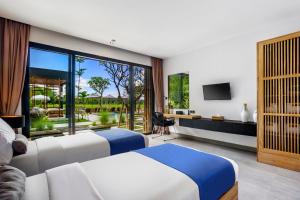 En eller flere senge i et værelse på Villa Noi by BaliSuperHost