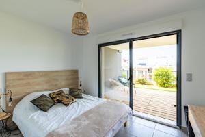 Postel nebo postele na pokoji v ubytování L'étincelle de Stagnola - Vue mer