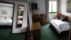 En eller flere senge i et værelse på Best Western Spreewald