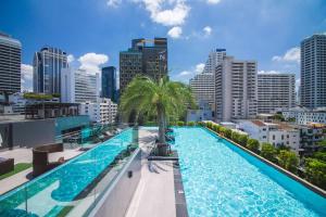 a large swimming pool on the roof of a building at SureStay Plus Hotel by Best Western Sukhumvit 2 in Bangkok