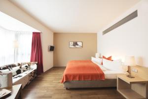Säng eller sängar i ett rum på Skihotel Galzig