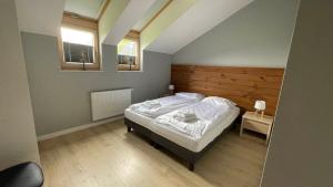 Posteľ alebo postele v izbe v ubytovaní Apartament DOMANIS z widokiem na góry