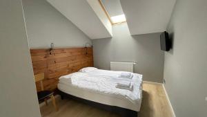 Posteľ alebo postele v izbe v ubytovaní Apartament DOMANIS z widokiem na góry