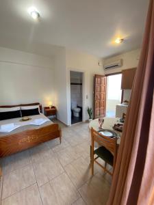 Ένα ή περισσότερα κρεβάτια σε δωμάτιο στο Arxodis Studio