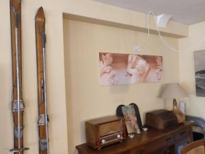 a room with a table with a radio and a picture at La Launa apartamento rural in Trevélez