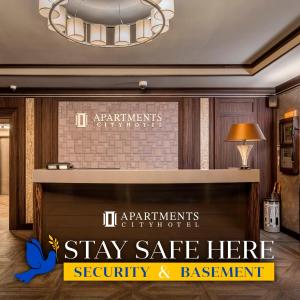 a sign in a hotel lobby with a sign that says stay safe here security at Cityhotel Apartments in Kyiv