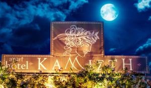 a sign for a hotel kaan sign with the moon in the background at Kallisti Hotel in Potos