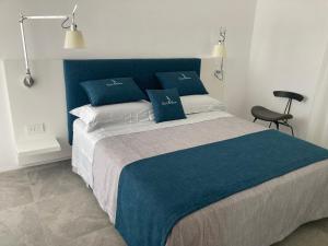 Кровать или кровати в номере “CapriOleum” esclusive place
