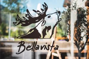 a sign for a restaurant with a picture of a reindeer at Hotel Bellavista in Silvaplana