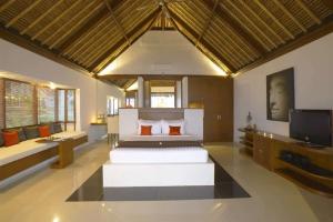 Voodi või voodid majutusasutuse Siddhartha Oceanfront Resort & Spa Bali toas