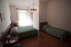 Postel nebo postele na pokoji v ubytování Tre Fiumi