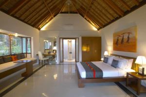 Voodi või voodid majutusasutuse Siddhartha Oceanfront Resort & Spa Bali toas