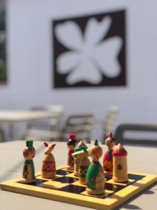 a chess board with figurines on top of it at Malva Hostel Estartit in L'Estartit +32 photos