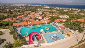 an overhead view of a swimming pool at a resort at Aegean View Aqua Resort in Psalidi