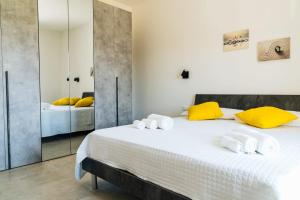 Posteľ alebo postele v izbe v ubytovaní Casa Vacanze Oltre La Caletta - 350 mt dalla spiaggia