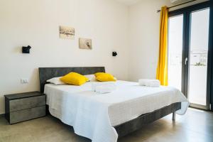 Posteľ alebo postele v izbe v ubytovaní Casa Vacanze Oltre La Caletta - 350 mt dalla spiaggia