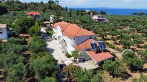 an aerial view of a house with orange roof at Villa Clelia in Vasilikos