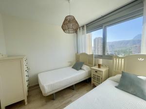 Posteľ alebo postele v izbe v ubytovaní Mirador Poniente Beach