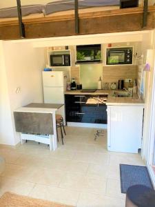 a small kitchen with a sink and a counter at VILLA BELLA I in La Seyne-sur-Mer
