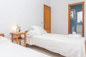 Postel nebo postele na pokoji v ubytování Gavina d'Or