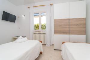 Postel nebo postele na pokoji v ubytování Gavina d'Or