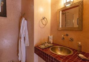 a bathroom with a sink and a mirror at Palais El Roucar in Marrakesh +17 photos