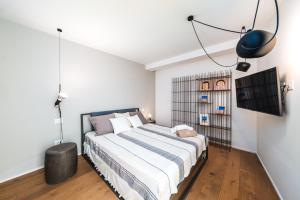 a bedroom with a large bed in a room at HelloApulia Villa Gemma with private eco pool and with direct access to the sea in Polignano a Mare +35 photos