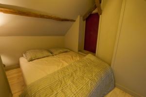Postel nebo postele na pokoji v ubytování De Reiskoffer + 3 fotografie