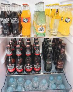 a refrigerator filled with lots of different types of soda at El Nido de Alaro - Turismo de Interior in Alaró