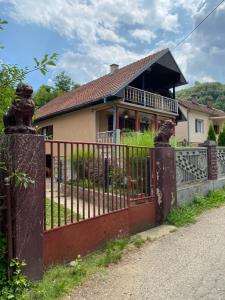 a house with a iron gate in front of it at Vila Ilidža in Banja Koviljača